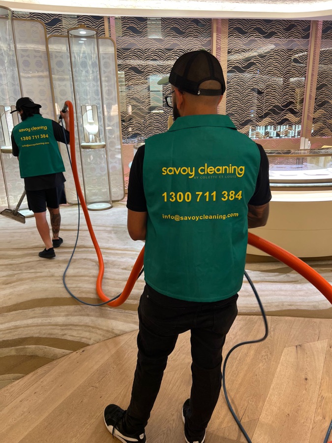 Reception carpet being vacuumed